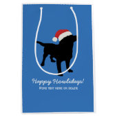 クリスマスのサンタクロースの帽子を身に着けている黒い実験室犬 ミディアムペーパーバッグ (正面)