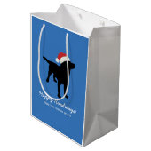 クリスマスのサンタクロースの帽子を身に着けている黒い実験室犬 ミディアムペーパーバッグ (裏面アングル)