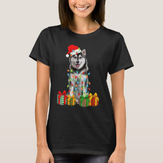 クリスマスのシベリアンハスキー犬のクリスマスライトの子犬 Tシャツ