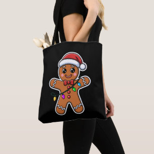 クリスマスのジンジャーブレッドマンのサンタ帽子のライト クリスマス トートバッグ