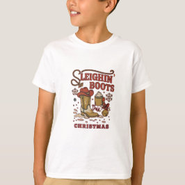クリスマスのソリブーツ 楽しいウエスタンカウボーイ Tシャツ