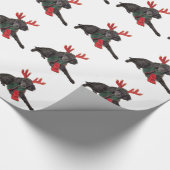 クリスマスのトナカイとして服を着る黒いトイプードル犬 ラッピングペーパー (角)