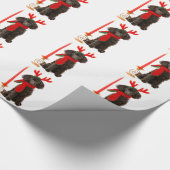 クリスマスのトナカイとして服を着る黒いトイプードル犬 ラッピングペーパー (角)