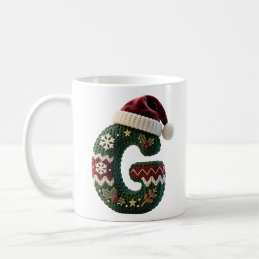 クリスマスのニットセーターの文字Gサンタ帽子 コーヒーマグカップ (左)