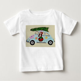 クリスマスのバセットハウンドがヒッピーカーに乗って ベビーTシャツ