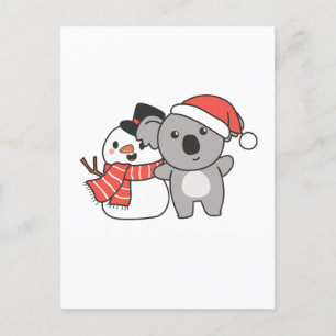 クリスマスの冬に雪だるまを持つコアラ シーズンポストカード