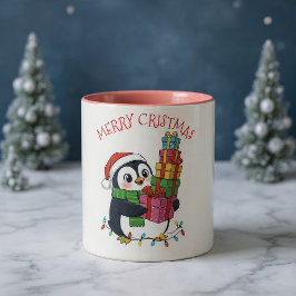 クリスマスの可愛いペンギンがプレゼントを持っている ツートーンマグカップ