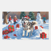 クリスマスの帽子をかぶったシベリアンハスキーの雪上ラン 長方形シール (正面)