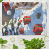 クリスマスの帽子をかぶって雪の中を走るケアン・テリア キッチンタオル (折り畳み)