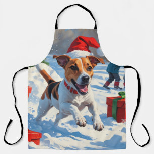 クリスマスの帽子をかぶって雪の中を走るジャック・ラッセル エプロン