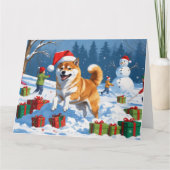 クリスマスの帽子をかぶって雪の中を走る柴犬 カード (正面)