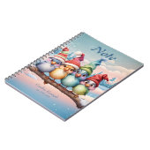 クリスマスの帽子を持つかわいいファンタジーの鳥 ノートブック (左側)