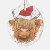 クリスマスの帽子を持つクリスマスの鳴き声の高地牛 セラミックオーナメント (左)