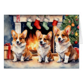 クリスマスの暖炉のそばのコーギー犬の3人組 (正面横)