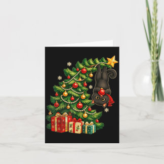 クリスマスの木からぶら下がる黒猫のペット カード