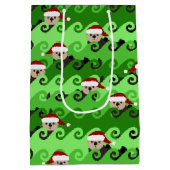 クリスマスの海のカワウソ緑の波 ミディアムペーパーバッグ (裏面)