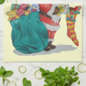 クリスマスの準備をしているかわいいサンタ キッチンタオル (折り畳み)