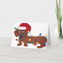 クリスマスの照明で(赤い)もつれるダックスフント シーズンカード