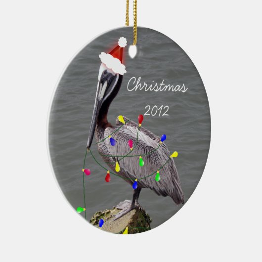 クリスマスの照明を持つペリカン セラミックオーナメント (右)