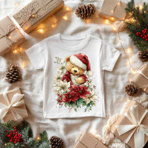 クリスマスの花を持つテディベアのサンタクロース ベビーTシャツ