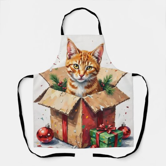 クリスマスの荷物開封中！？いたずら猫と段ボール箱 エプロン (正面)