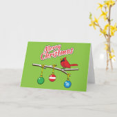 クリスマスの裸の枝に立つルビー色のカーディナル - メリークリスマス カード (黄色い花)