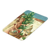 クリスマスの贈り物やプレゼントを運ぶ天使 マグネット (左側)