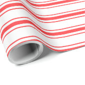 クリスマスの赤いマットレスのカチカチ音をたてるベッドは縞で飾ります ラッピングペーパー (ロールコーナー)
