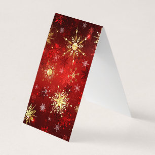 クリスマスの金色の雪の結晶 赤い背景 名刺