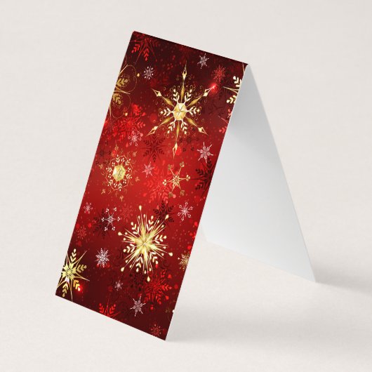 クリスマスの金色の雪の結晶 赤い背景 名刺 (裏面)