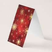 クリスマスの金色の雪の結晶 赤い背景 名刺 (正面)