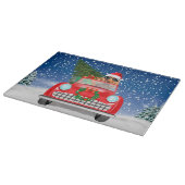 クリスマスの雪の中を車を運転するコッカー・スパニエル カッティングボード (角)