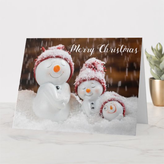 クリスマスの雪の家族 カード (小さな植物)