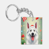 クリスマスの飾り付けに囲まれポーズをとる犬 キーホルダー (正面左)