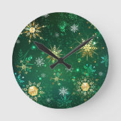 クリスマスの黄金の雪が緑の背景に ラウンド壁時計 (正面)
