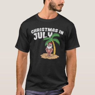 クリスマスイン7月ビーチサンタおもしろいサマーバカチ Tシャツ