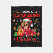 クリスマスオーナーのサンタ・ドッグにダックスフントが欲しい フリースブランケット (正面)