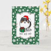 クリスマスサンタハットポメラニア犬（トライカラー）かわいい カード (黄色い花)