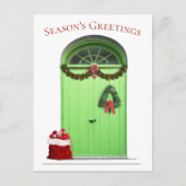 クリスマスシーズンのグリーティンググリーンドアテンプレート シーズンポストカード (正面)