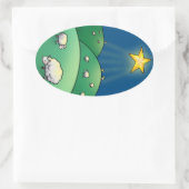 クリスマススターの下の羊の群れ 楕円形シール (バッグ)