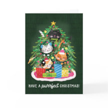 クリスマスツリーとプレゼントに囲まれたかわいい猫たち