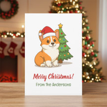 クリスマスツリーと赤い帽子のかわいいコーギー犬