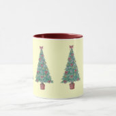 クリスマスツリーに赤い弓のベルを飾る マグカップ (中央)