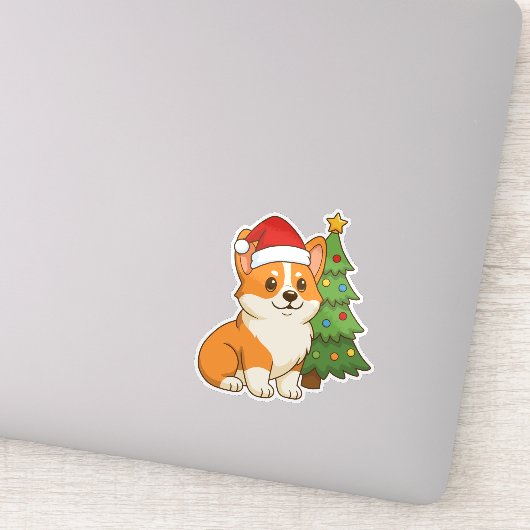 クリスマスツリーのそばの赤い帽子のかわいいコーギー犬 シール (詳細)