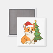 クリスマスツリーのそばの赤い帽子のかわいいコーギー犬 マグネット (正面/裏面)