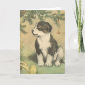 クリスマスツリーの下でヴィンテージクリスマス、かわいい子犬 シーズンカード (正面)
