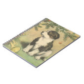 クリスマスツリーの下でヴィンテージクリスマス、かわいい子犬 ノートブック (左側)