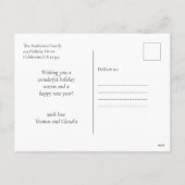 クリスマスツリーの下で秘密の宇宙飛行士のサンタの贈り物 シーズンポストカード (裏面)