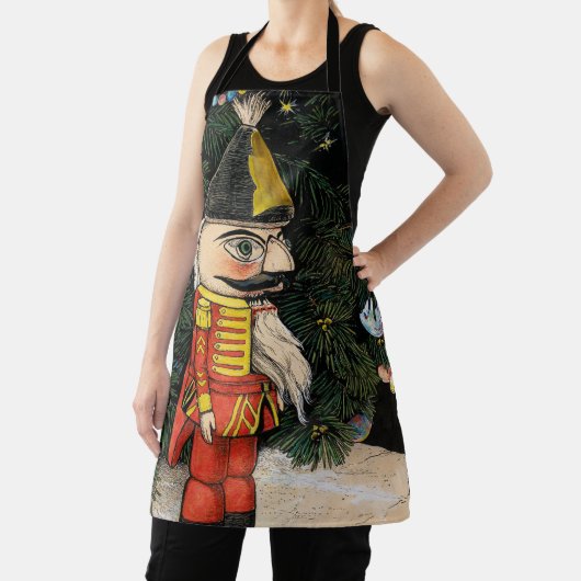 クリスマスツリーの下のビンテージのくるみ割り人形 エプロン (インサイチュ)