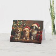 クリスマスツリーの下の可愛い犬と猫